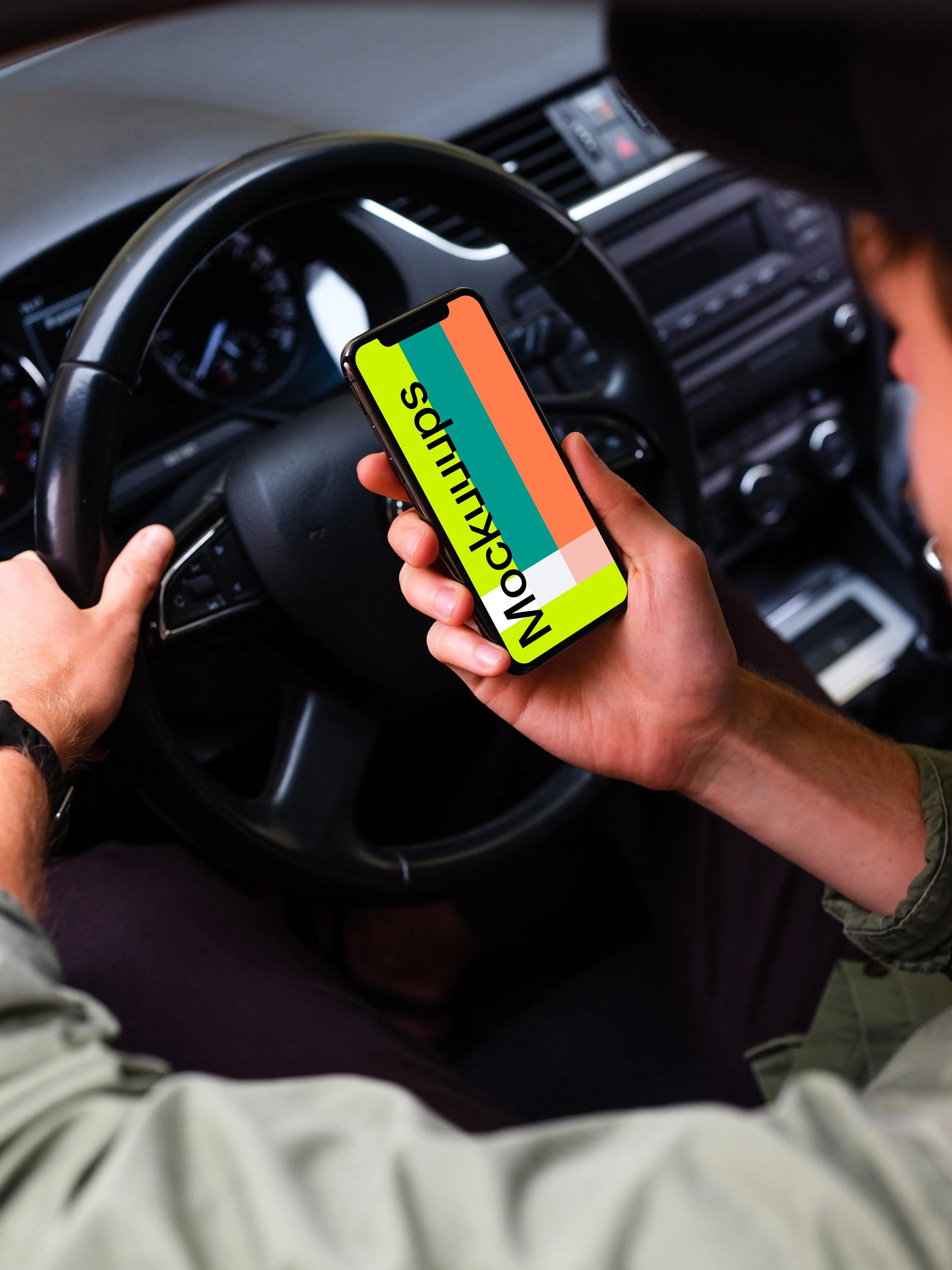 Over the shoulder view of a driver using iPhone 11 mockup