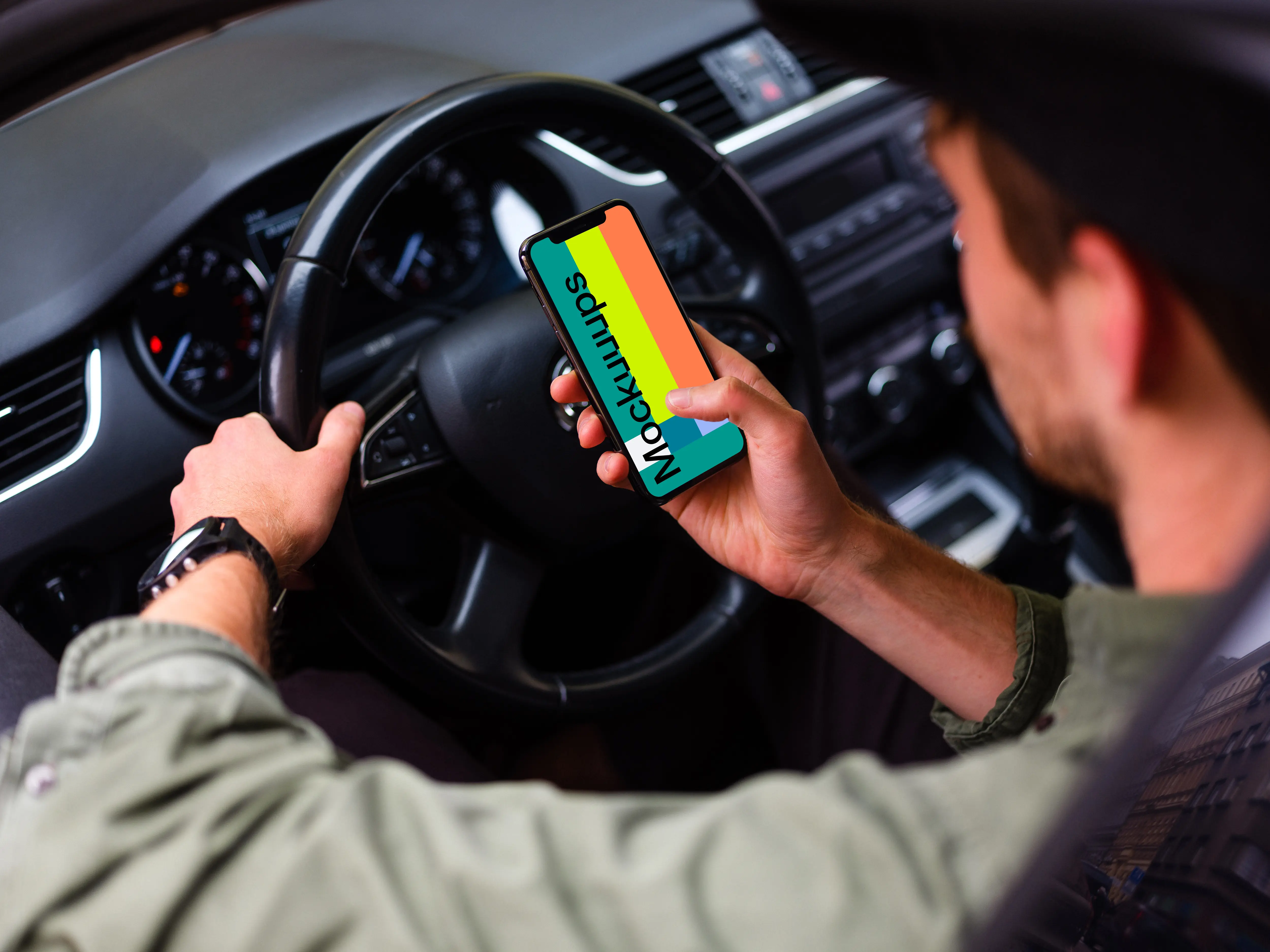 Over the shoulder view of driver tapping iPhone 11 mockup