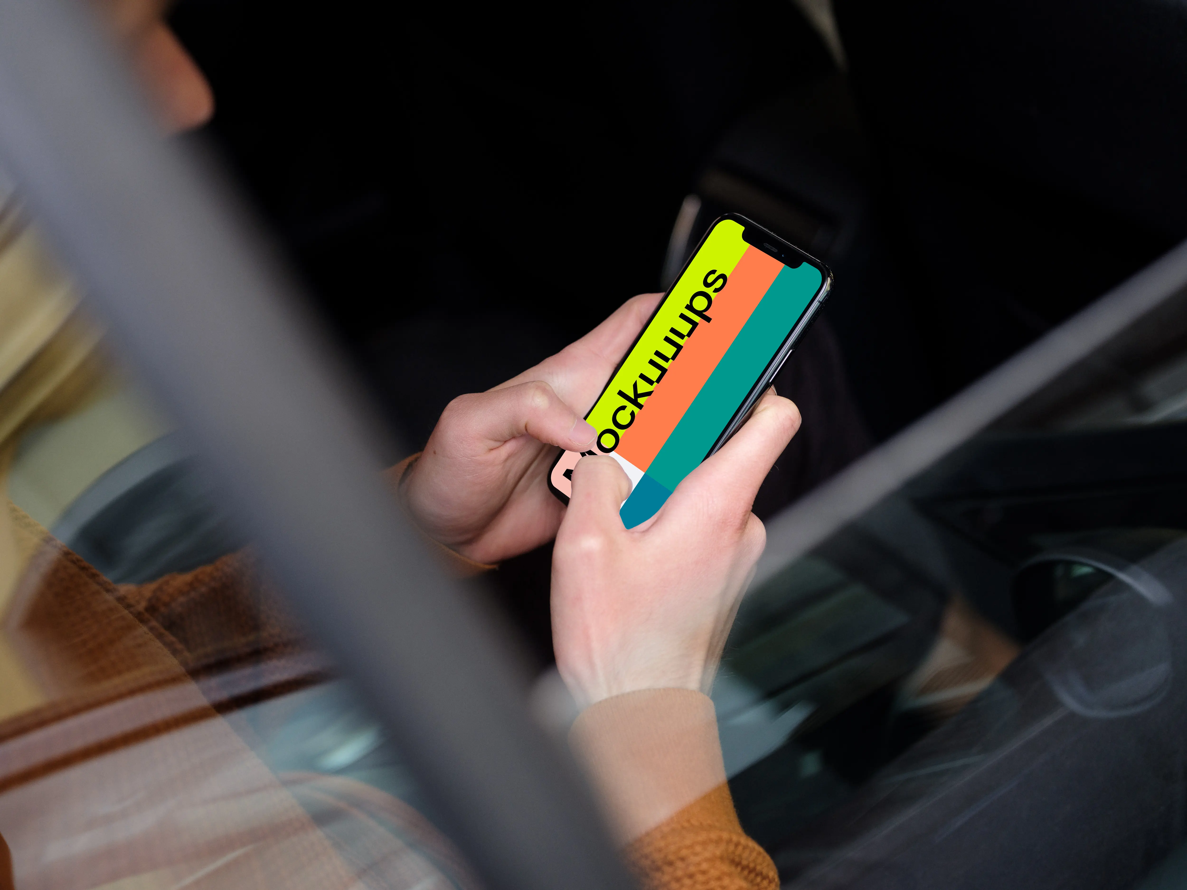 Over the shoulder view of passenger typing on iPhone 11 mockup