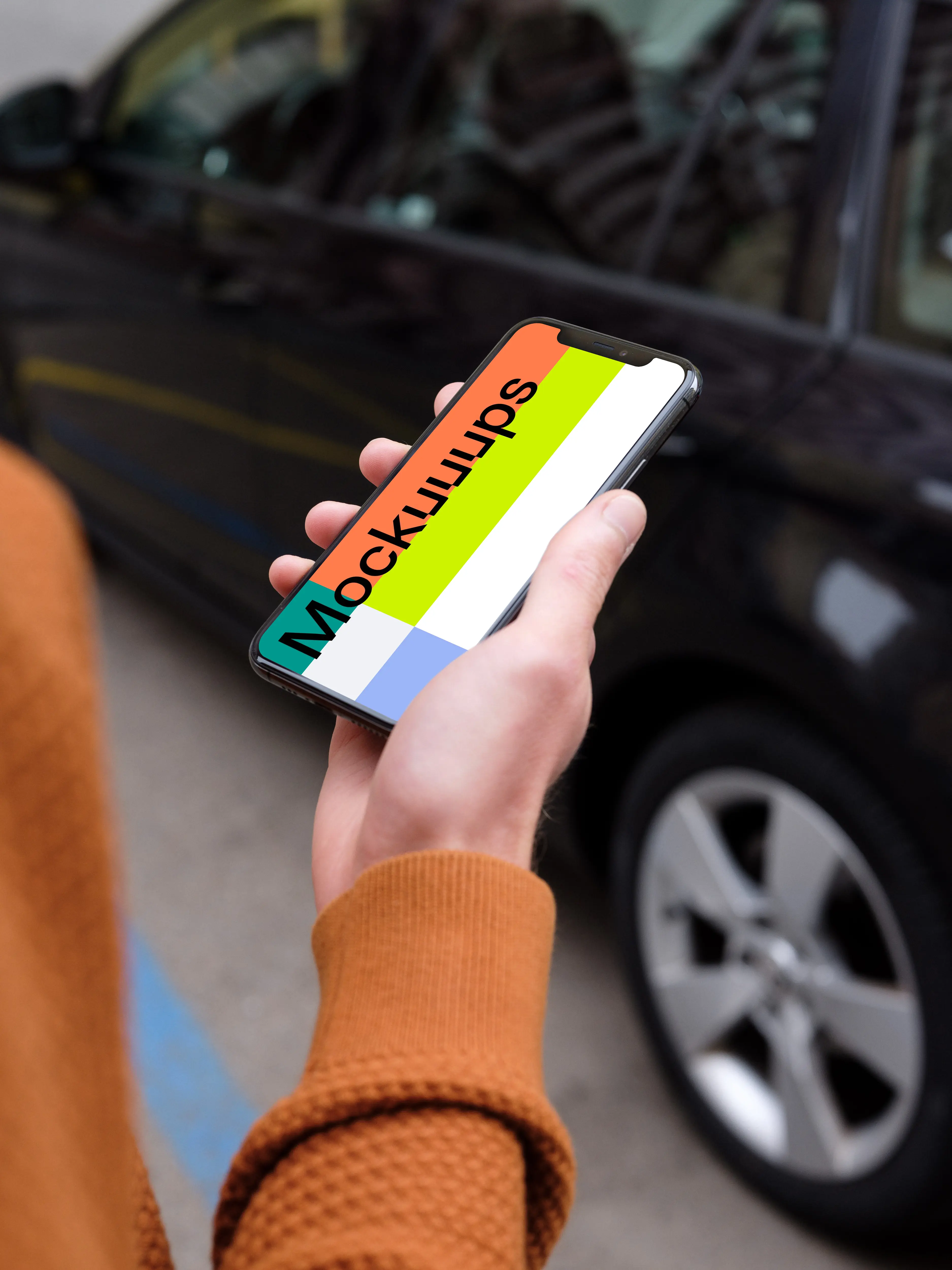 Passenger walking towards a car holding an iPhone 11 mockup