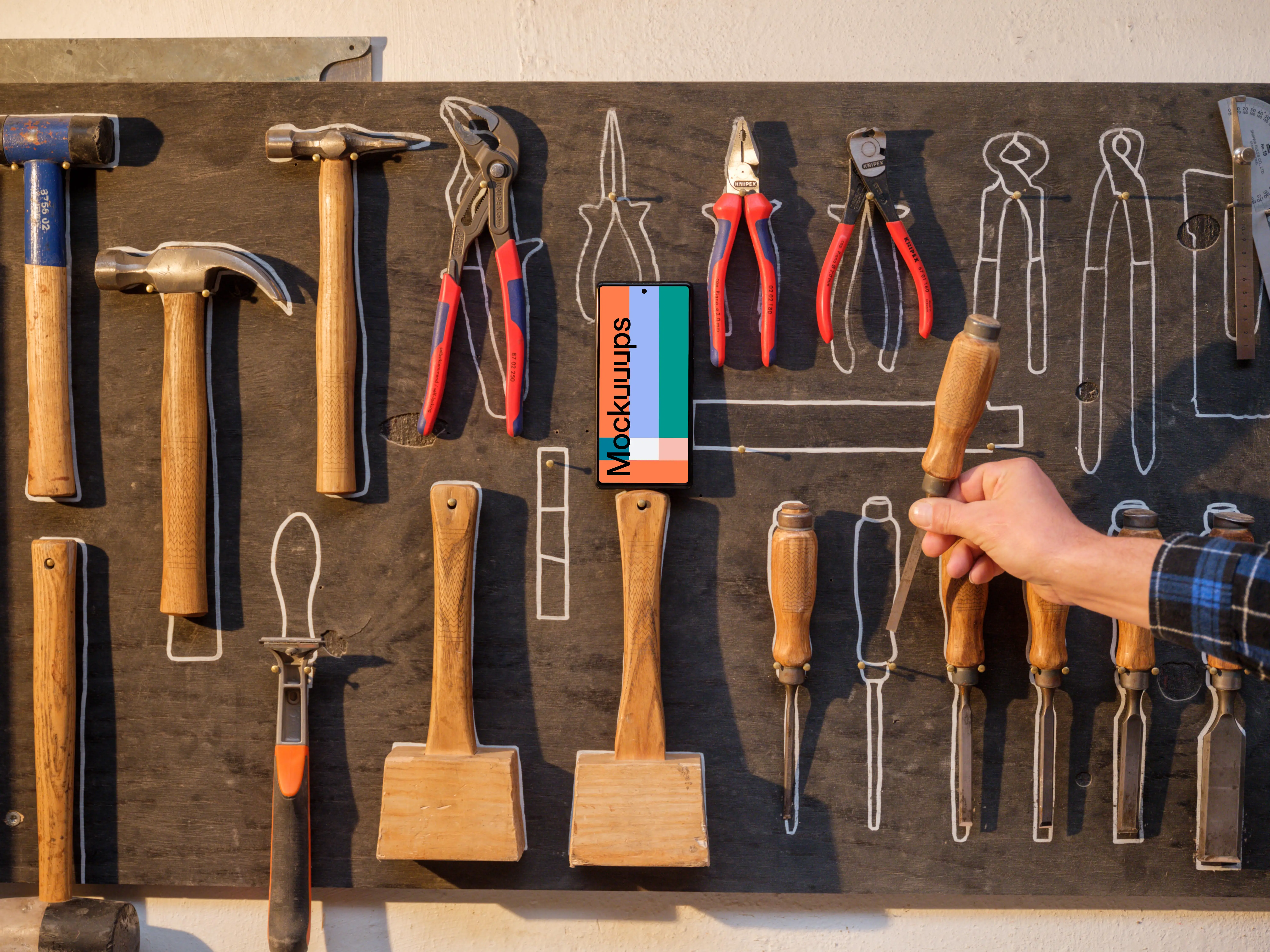 Phone mockup on the wall with tools