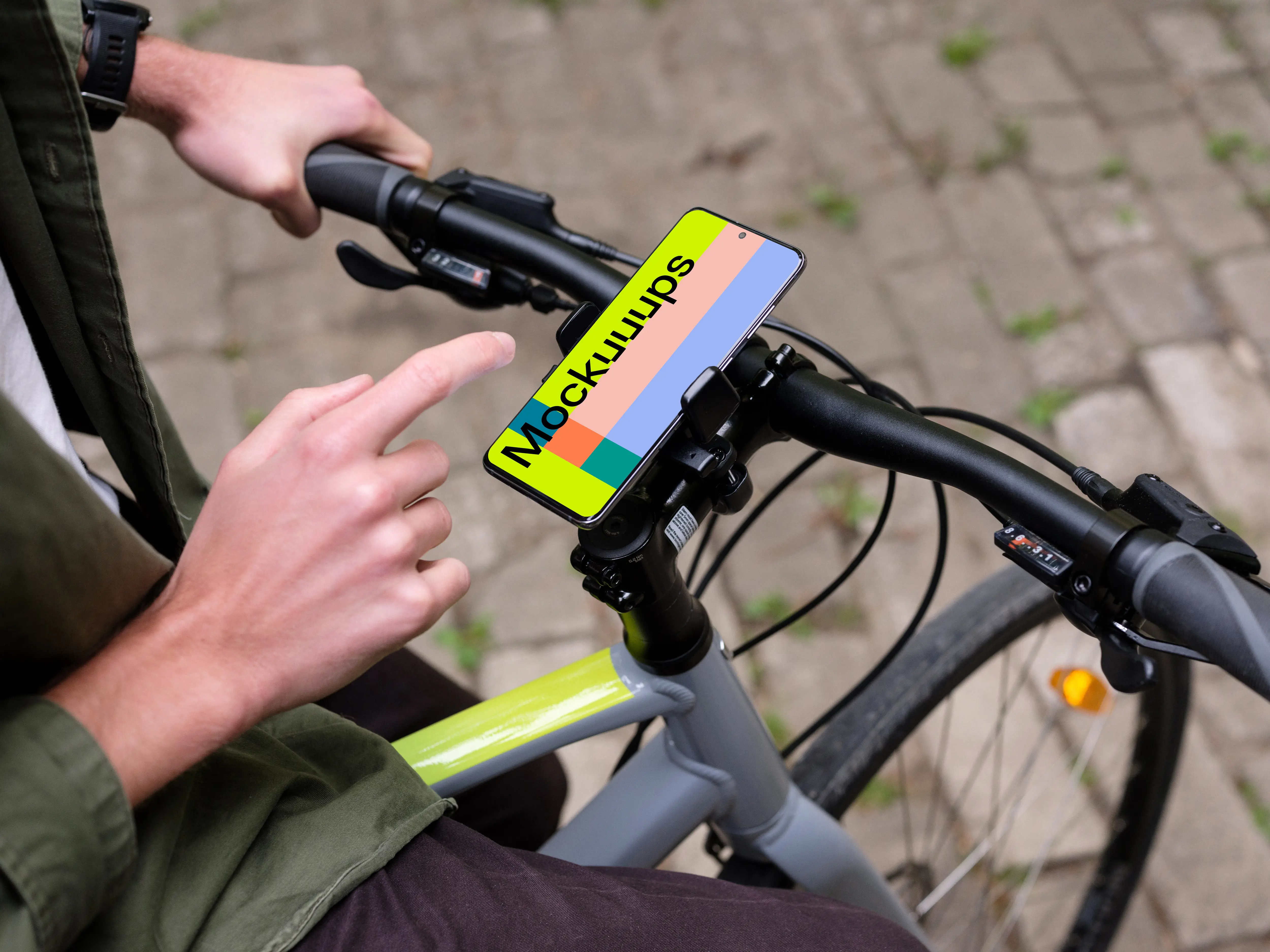 Sitting on bike tapping Samsung S20 mockup in a bike mount