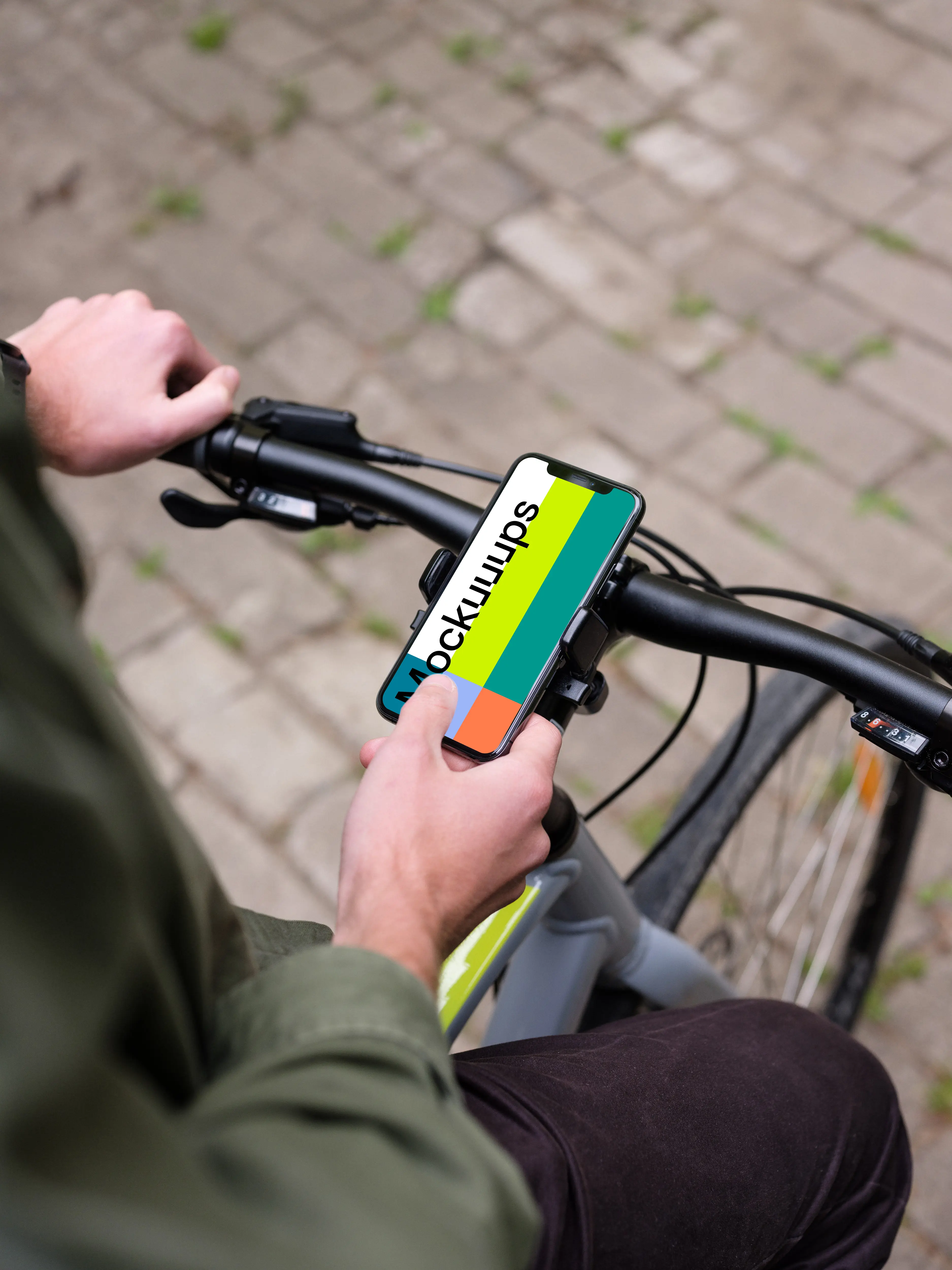 Sitting on bike tapping the iPhone 11 Pro mockup in bike mount