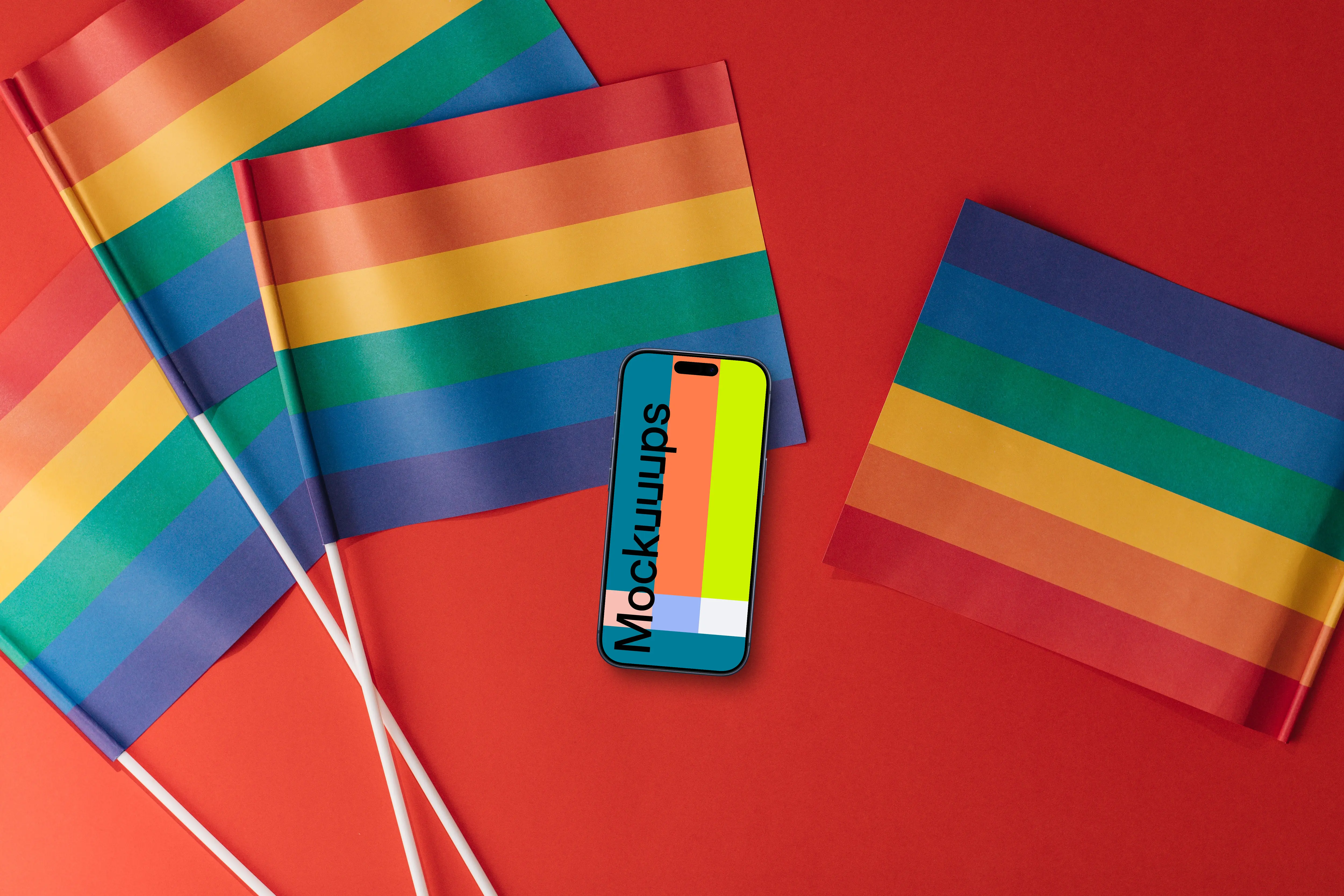 Smartphone mockup on a red surface with LGBT flags around