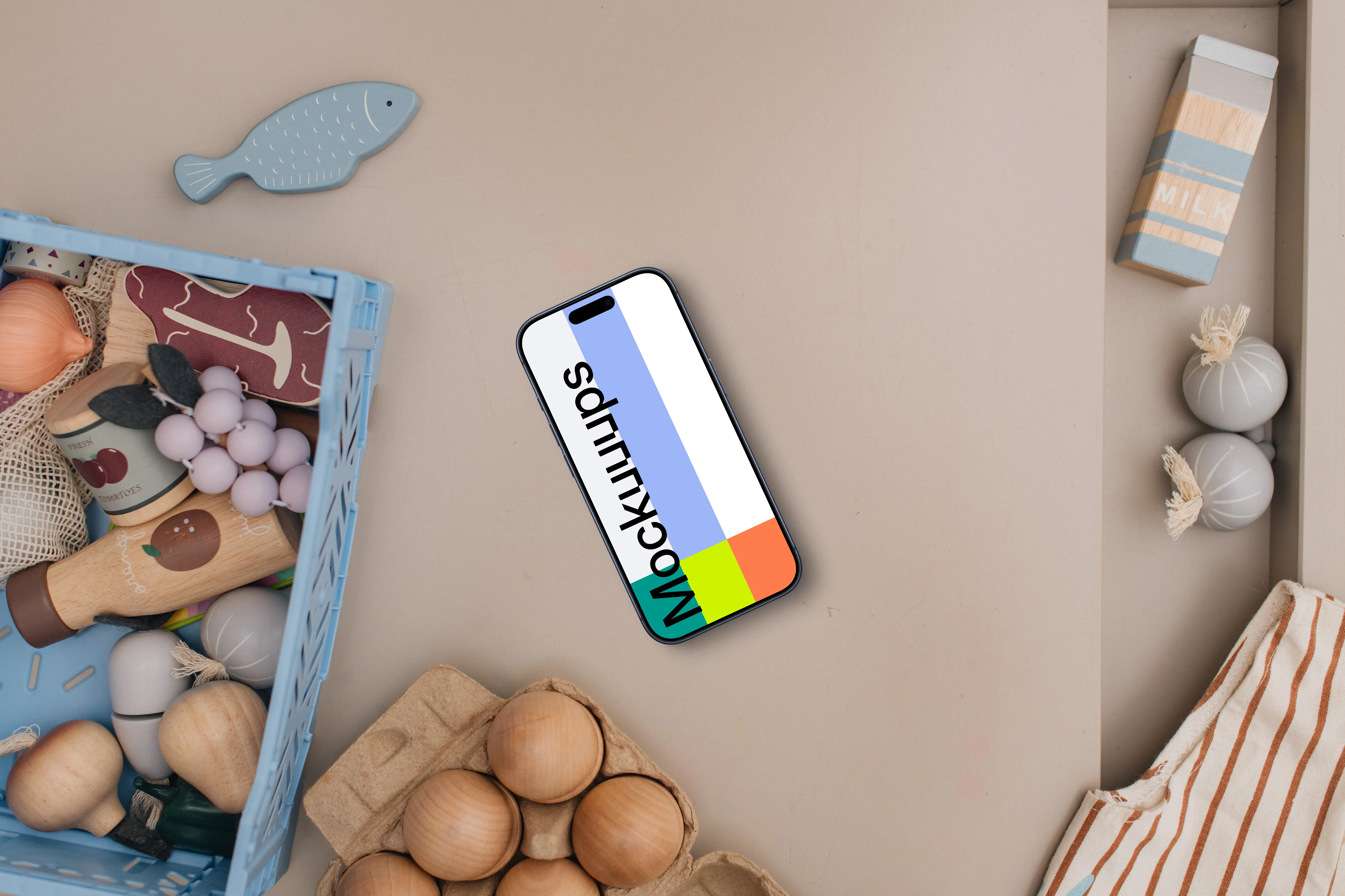 Smartphone mockup with kids' creative play items