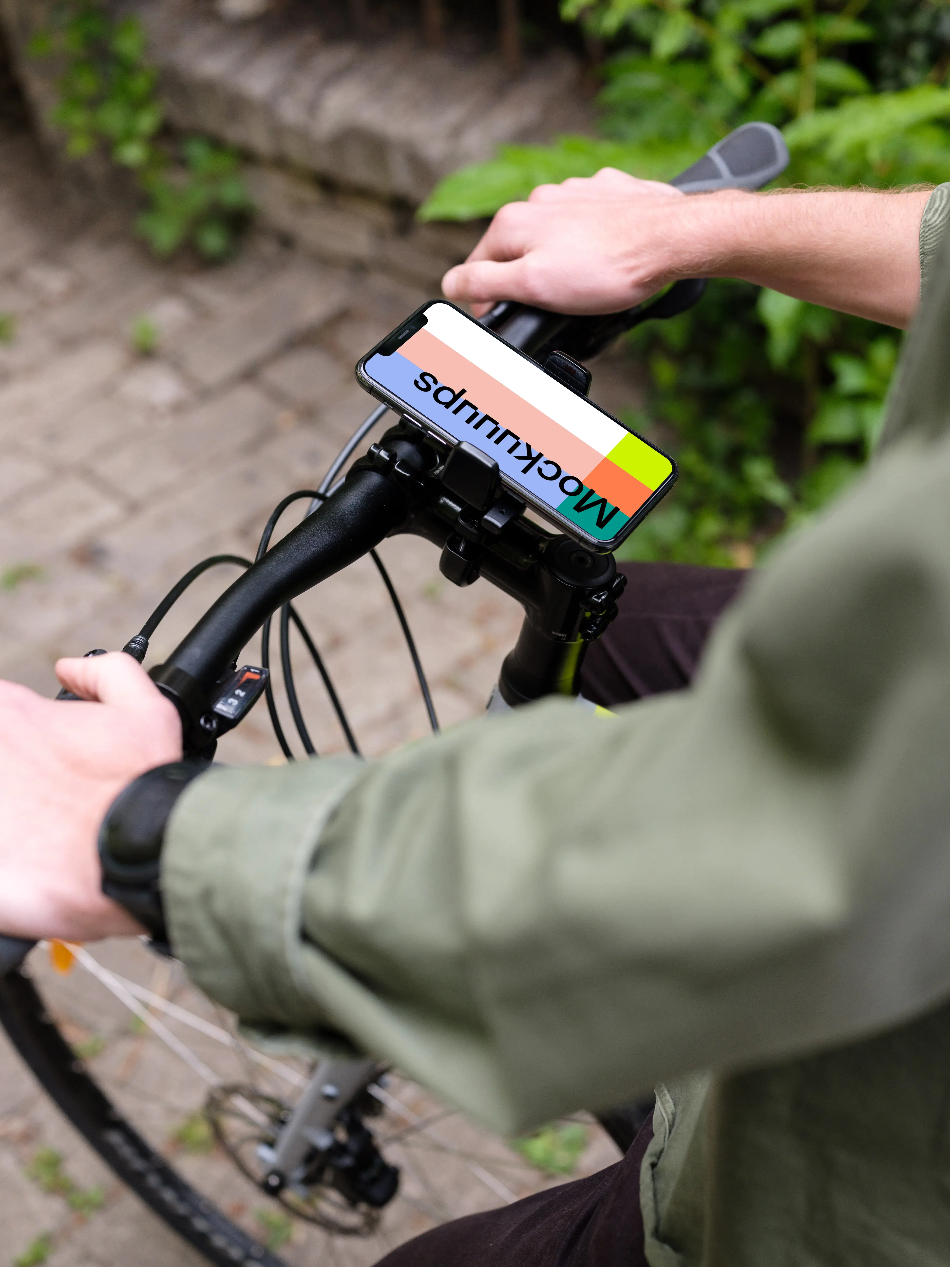 Standing on a bike with iPhone 11 Pro mockup in bike mount