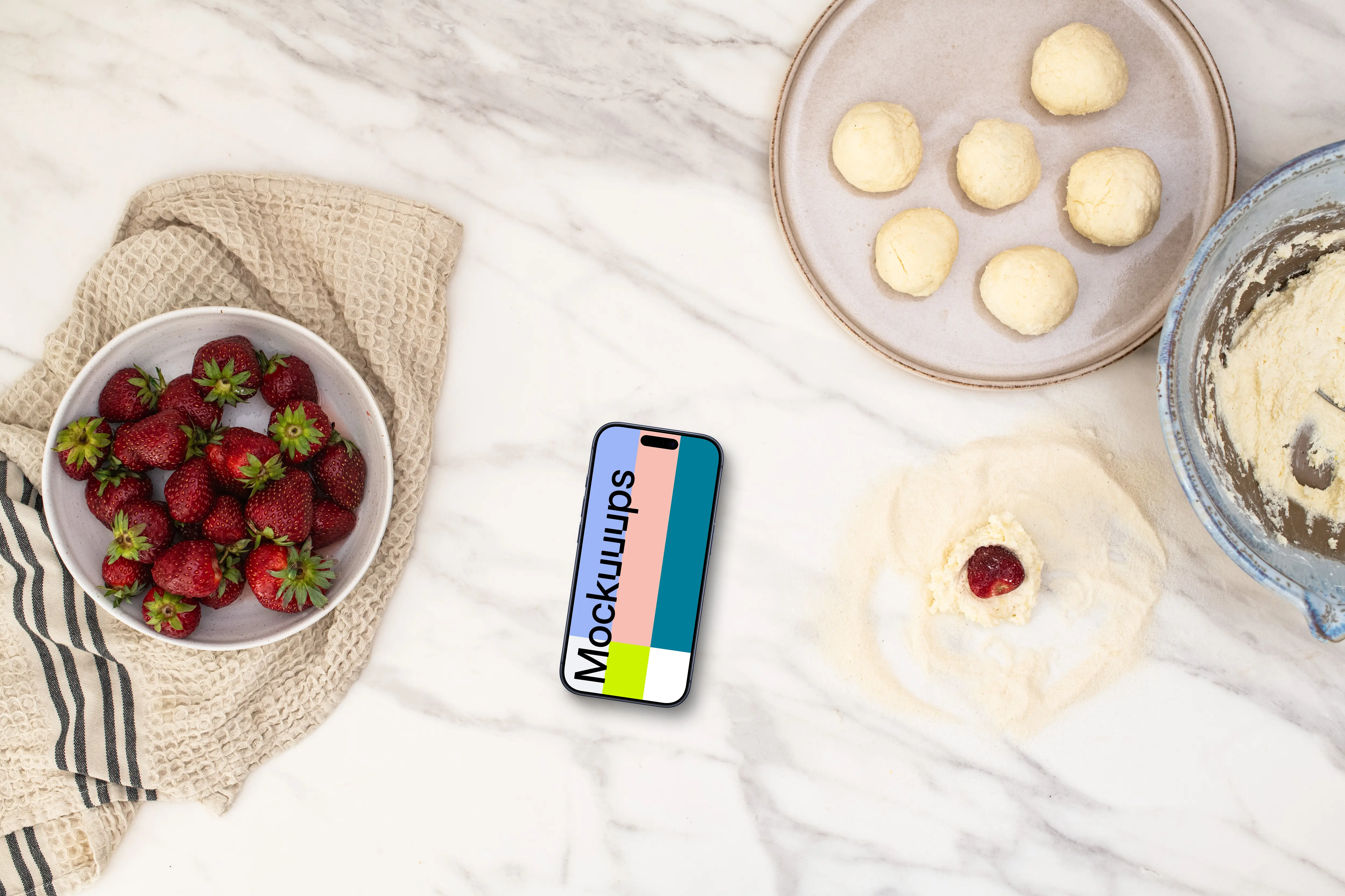 Strawberries and sweets next to the iPhone mockup