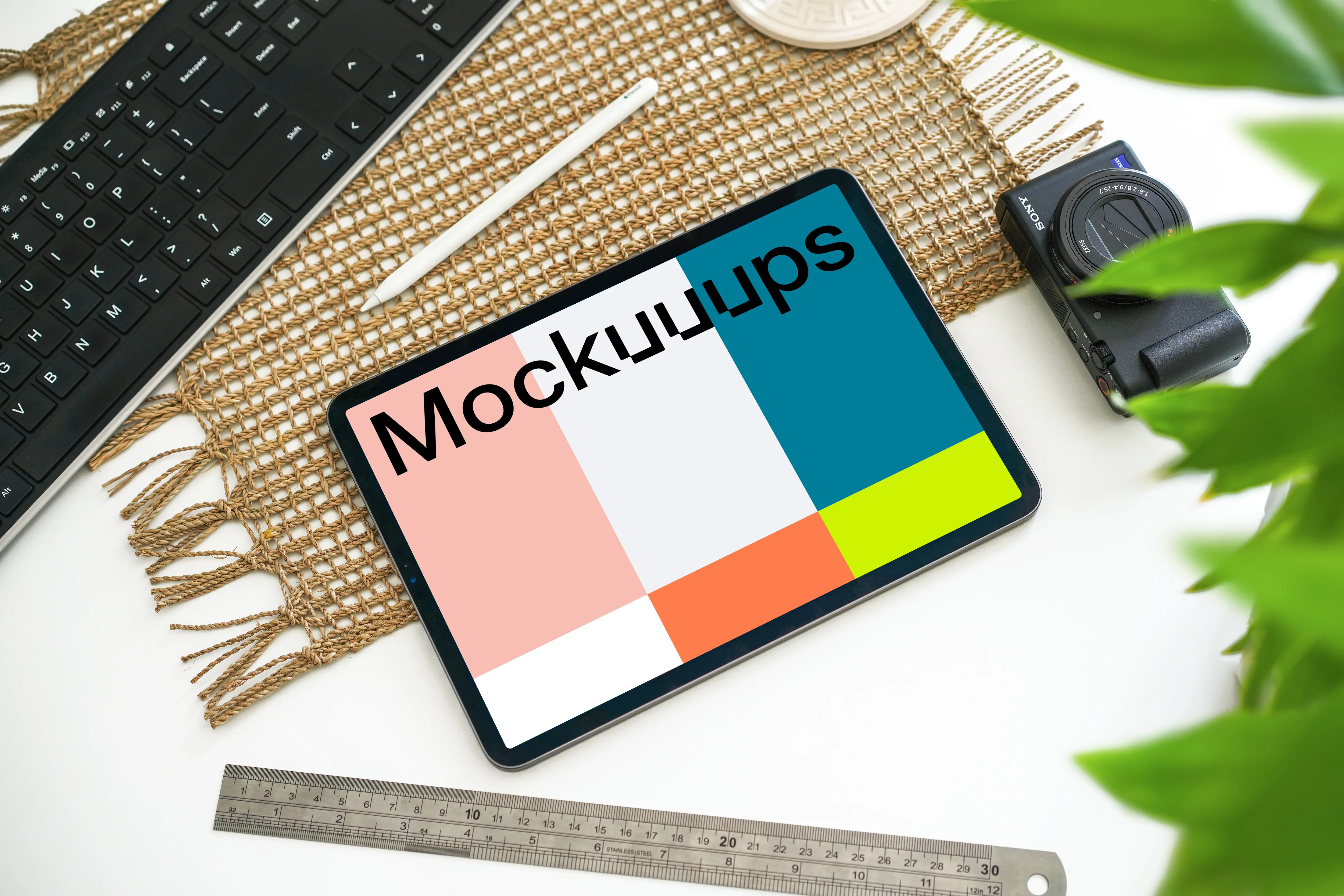 Tablet mockup beside a Canon camera