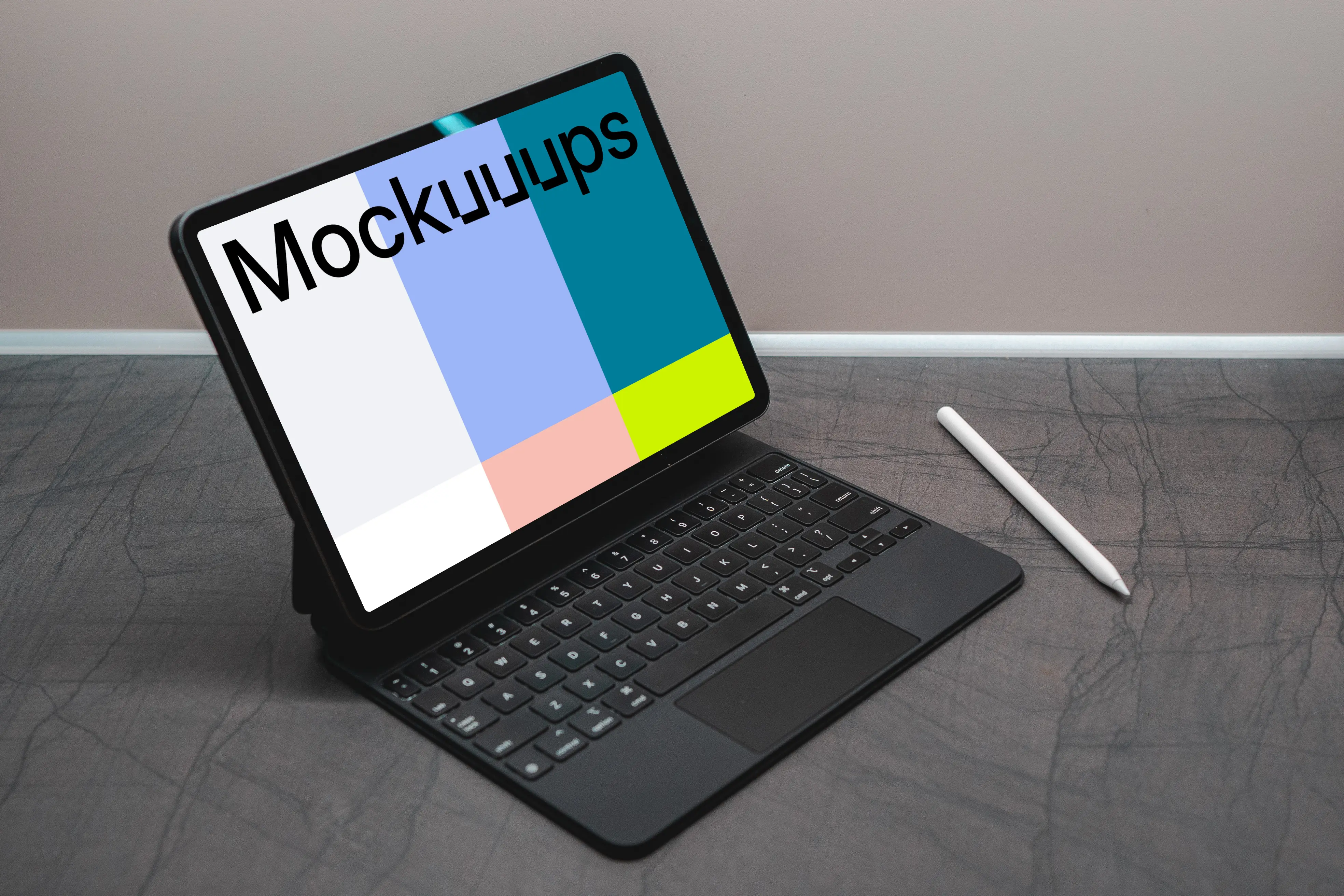 Tablet mockup on a black table with an Apple pencil at the side.