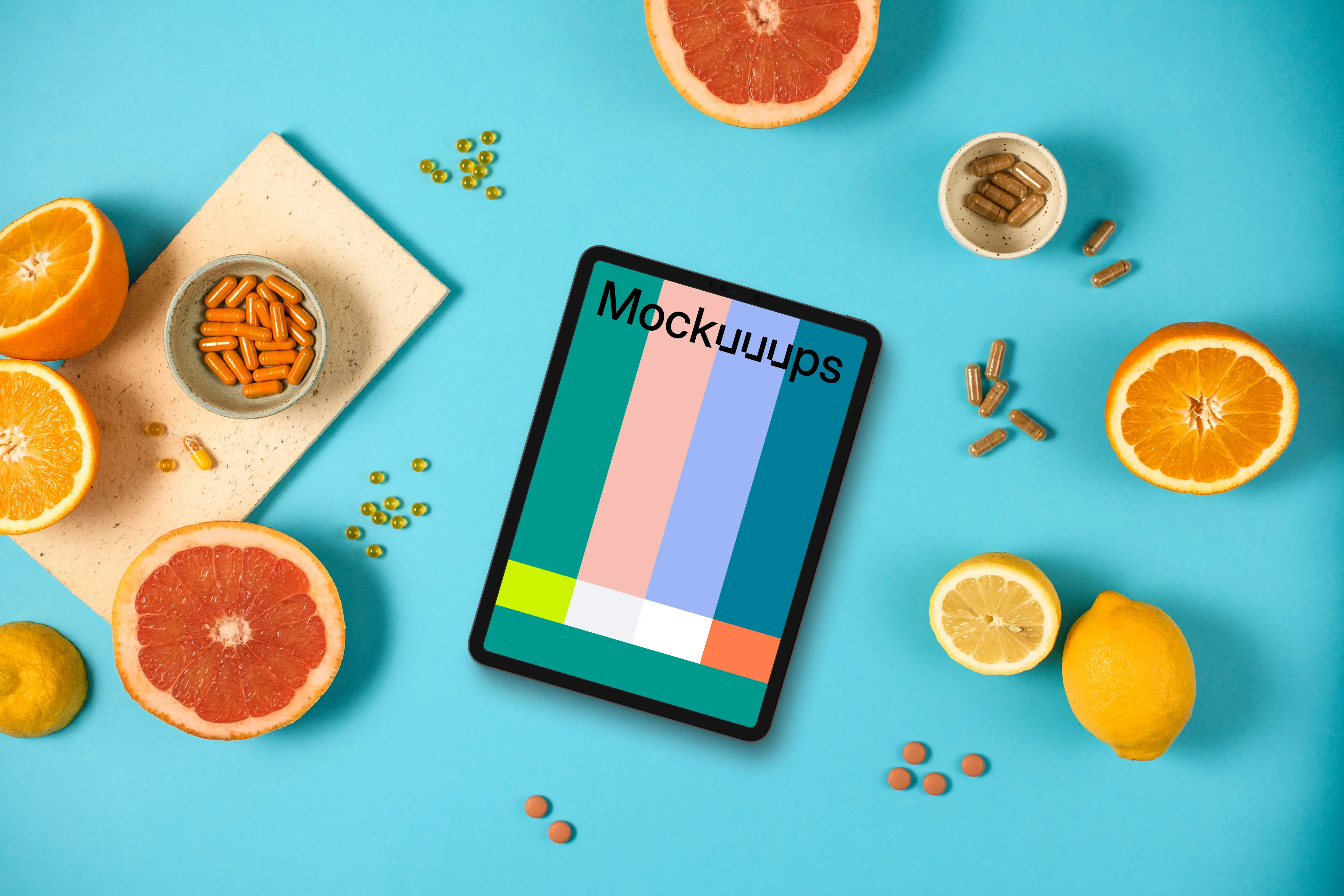 Tablet mockup with oranges and pills