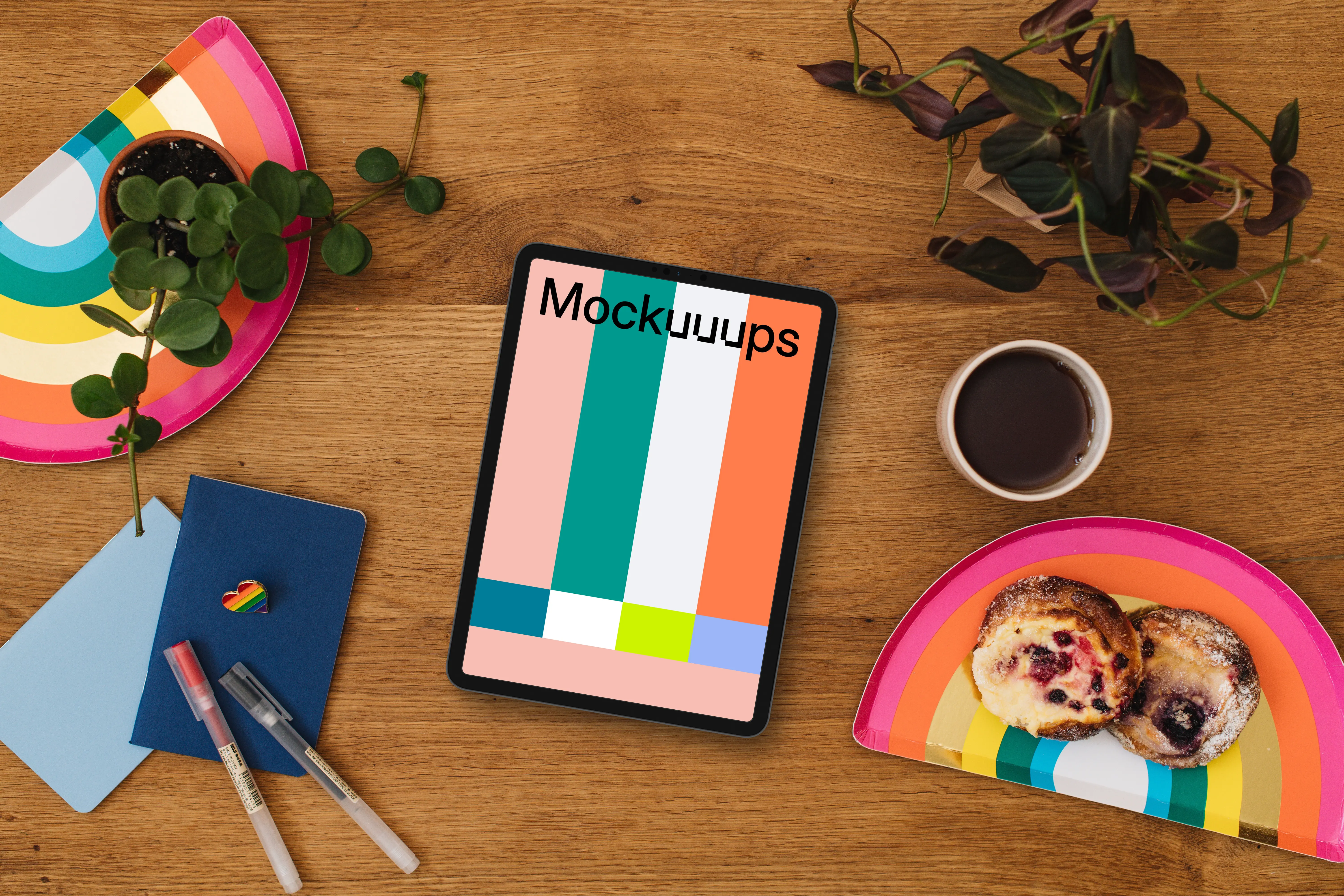 Tablet mockup with rainbow trays and a rainbow heart pin