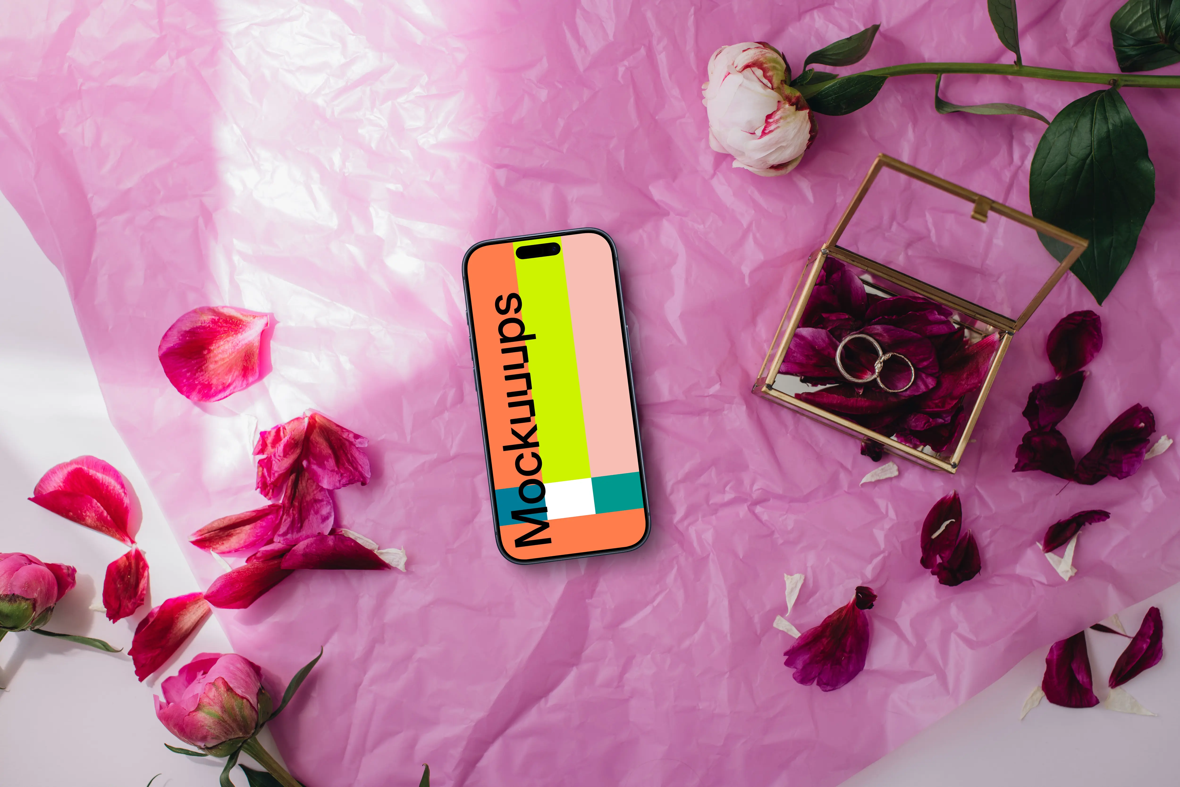 Wedding themed iPhone mockup with pink background and rose petals