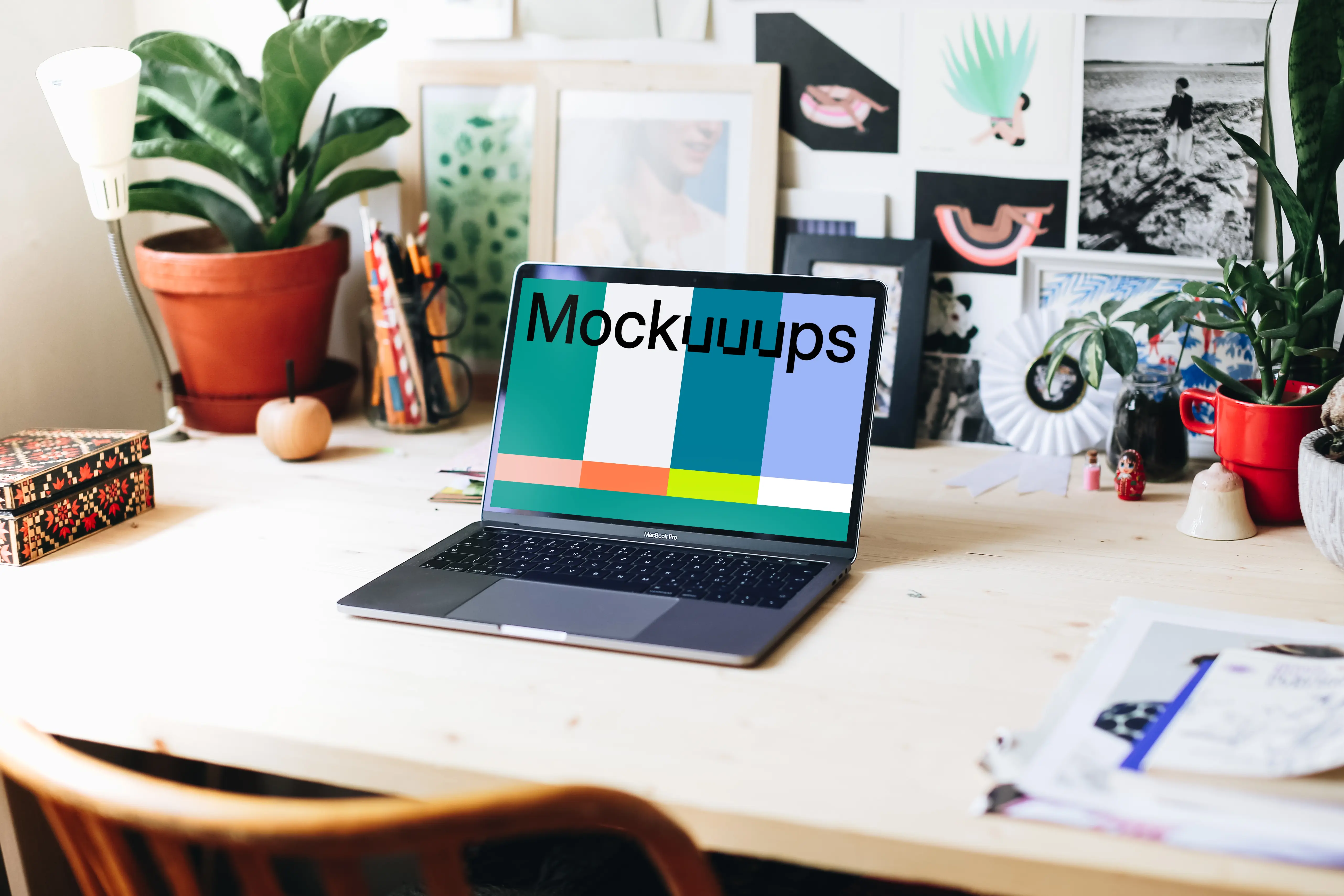 Wide view mockup of the creative workspace with Macbook Pro