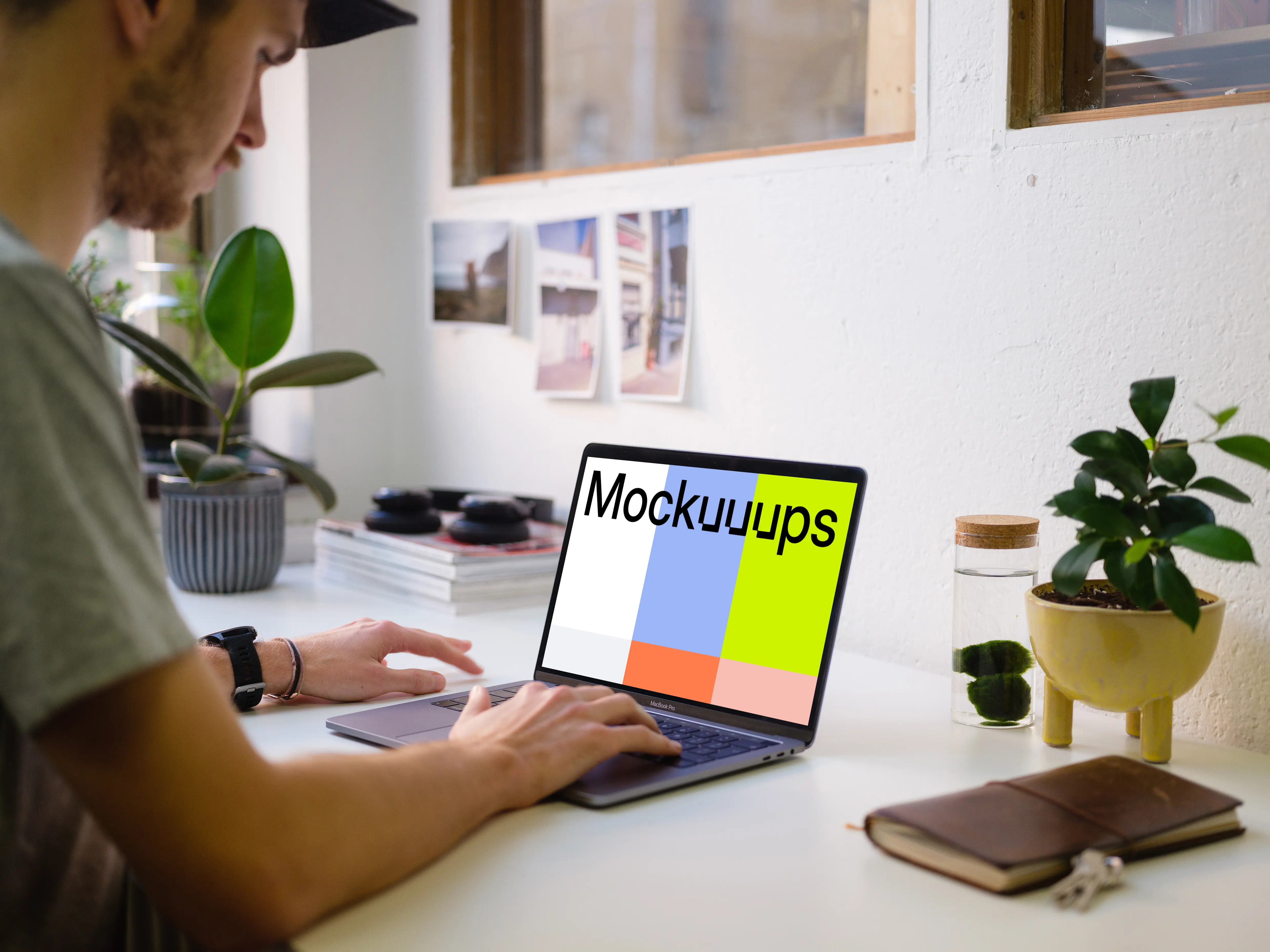 Young man working on the Macbook Pro mockup