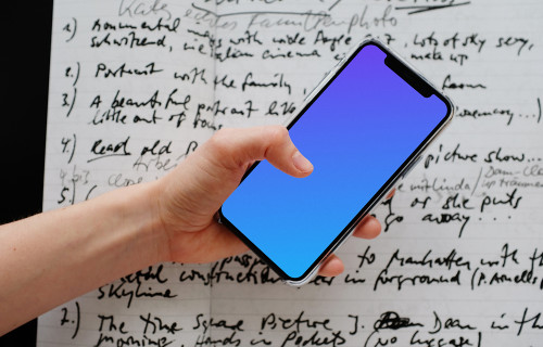 iPhone 12 Pro mockup held over a sheet of paper