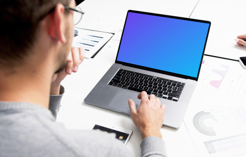 MacBook Pro mockup in a meeting