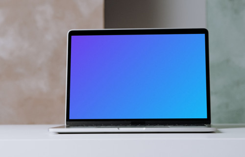 MacBook Pro mockup on a table in plain view