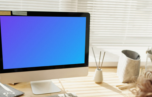 Child playing in front of an iMac computer mockup