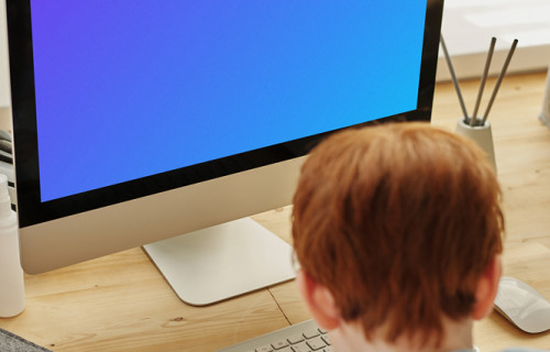 Computer Mockup of a Kid Using His iMac for School project