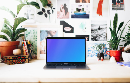 Creative workspace mockup with front view of Macbook Pro
