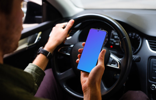 Driver viewing Samsung S20 mockup with hand on the wheel