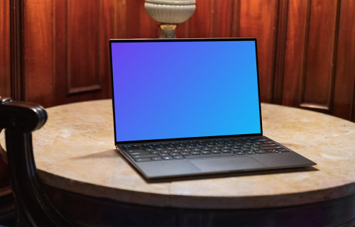 Black Dell XPS Mockup on a table with furniture