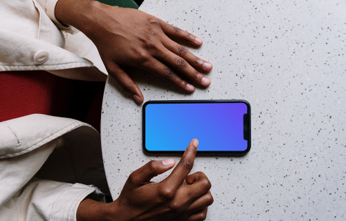 iPhone mockup on white table