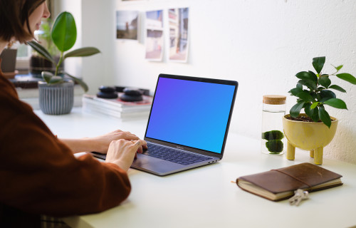 Young woman working on the Macbook Pro mockup