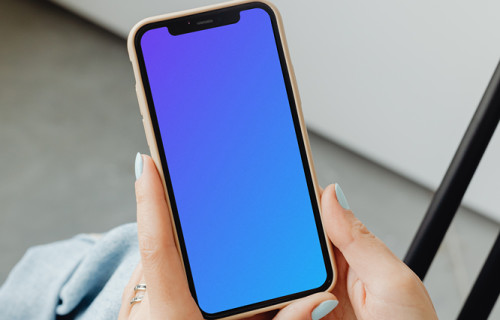 A simple handheld iPhone mockup help above the laps of a user