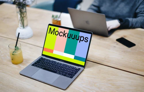 Angle view mockup of Macbook Pro on the wooden table