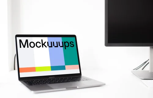 Angle view of the Macbook Pro mockup in the bright office