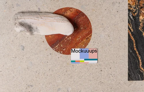 Business card mockup on a terrazzo surface with abstract accents