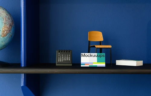 Business card mockup on decorative shelf with accessories