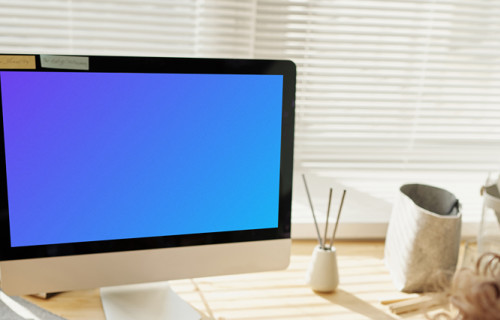 Child playing in front of an iMac computer mockup