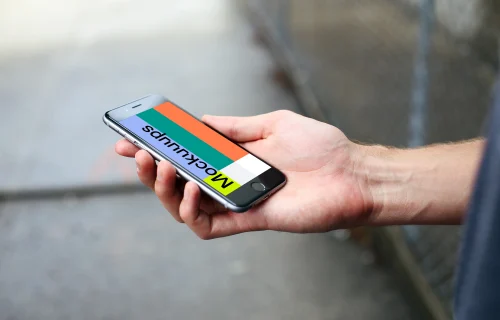 Closeup of iPhone 6s mockup on a Street