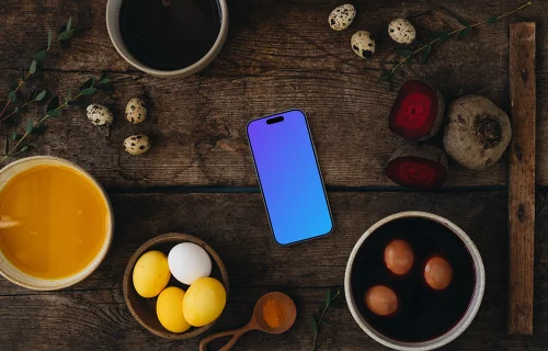 Coloring Easter eggs next to a smartphone mockup