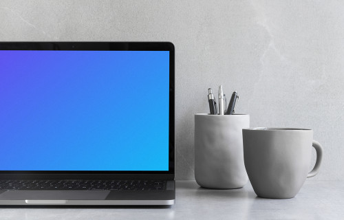 Cropped view of Macbook Pro mockup on the gray table