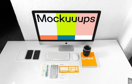 Front view of iMac mockup on white working desk