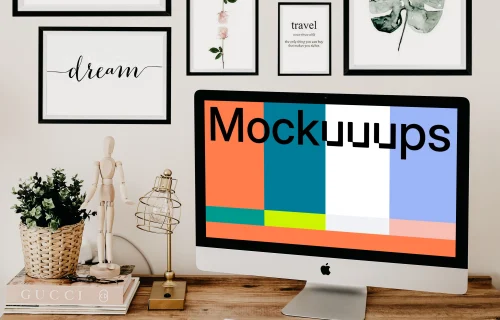  iMac mockup on a table with artwork in the background