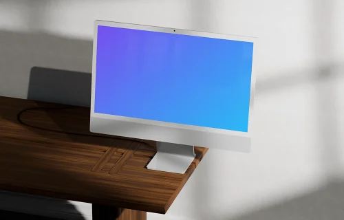 iMac mockup on a wooden desk in sunlight