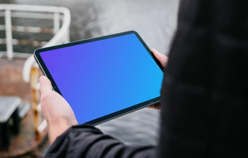 iPad Air mockup held by a user