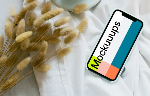 iPhone 12 mockup with a cup of coffee