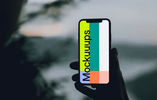 iPhone 12 Pro mockup held by a user