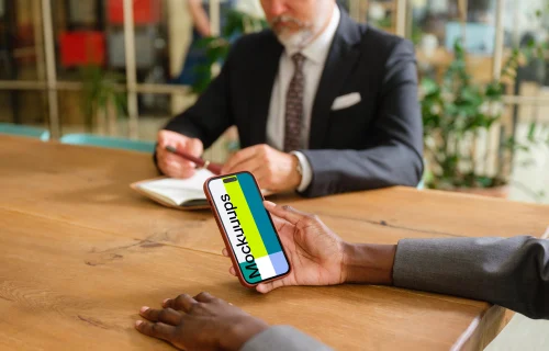 iPhone 14 Pro mockup in businesswoman’s hand