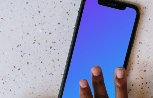 iPhone mockup beside a small cup of coffee