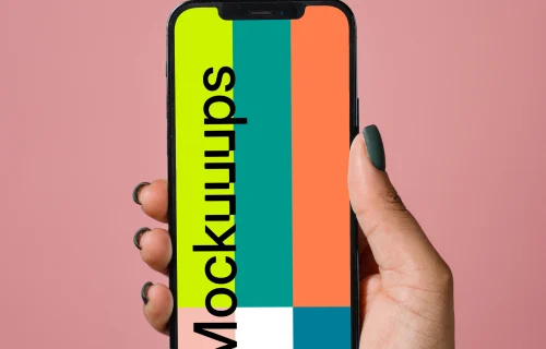 iPhone mockup held up by user in a pink background