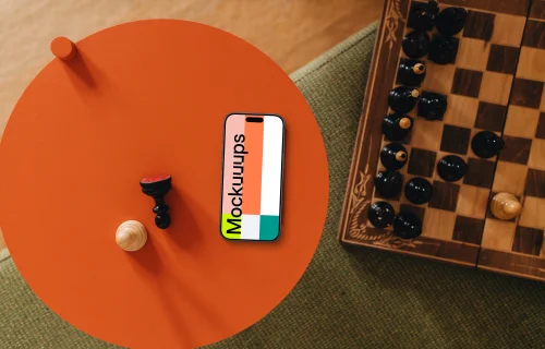 iPhone mockup next to the chess board game