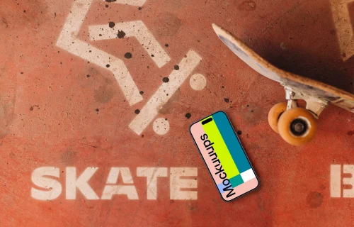 iPhone mockup next to the skateboard