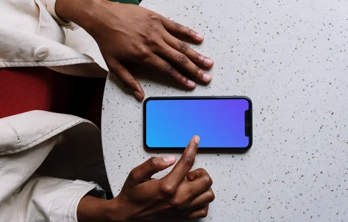 iPhone mockup on white table