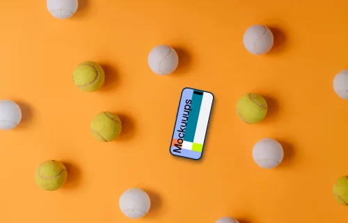 iPhone surrounded by tennis balls